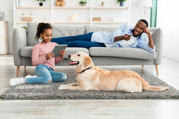 Black family and dog spending time together at home