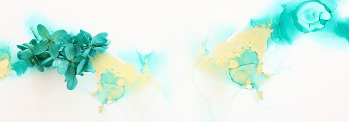 Creative image of emerald and green Hydrangea flowers on artistic ink background. Top view with copy space