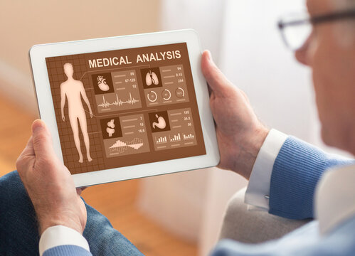 Unrecognizable man using medical app on digital tablet