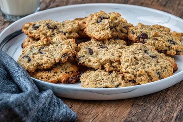 A plate of home made oatmeal and chocolate chip cookies on a plate - 476624350