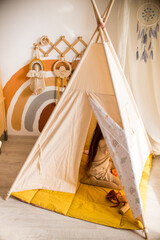 little girl playing in a wigwam © Маргарита Медведева