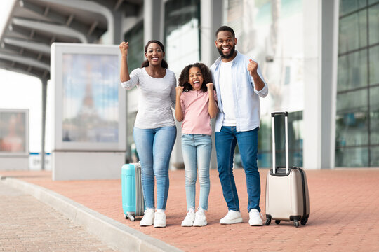 Happy black family traveling with kid, screaming yes