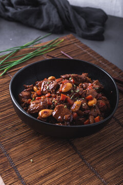 Bowl of delicious dish with stewed Asian chicken