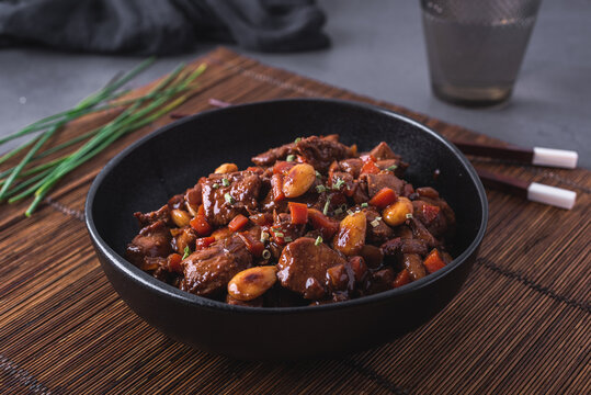 Bowl of delicious dish with stewed Asian chicken