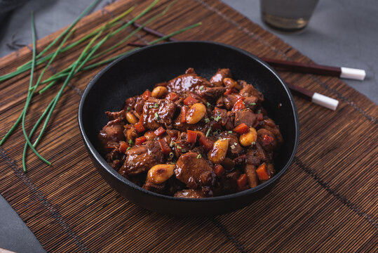 Bowl of delicious dish with stewed Asian chicken
