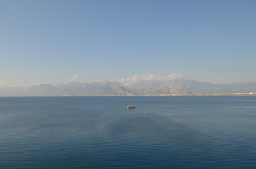 sea boat mountains sky