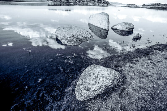 Blue lake idill under cloudline sky