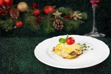 Fototapeta na wymiar Christmas Fresh tasty hot lasagna. Traditional italian food.