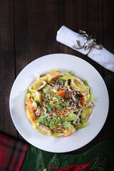 Seafood salad in cheese sauce. Flat lay.Top view.Copy space. Menu for a restaurant or cafe.Vertical photo. Festive serving.