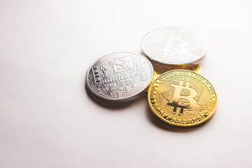 Multiple silver and gold Bitcoin coins, as a product shooting