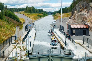 Kouvola, Finland - 5 August 2021: Kimola Canal between lakes. Gateway is open for boats going though.