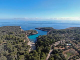 Fototapeta na wymiar Cala Sa Nau Mallorca. Aerial view of the seacoast of the beach in Mallorca with torquoise water colour. Amazing photo of the beach. Concept of summer, travel, relax and holiday and vacation