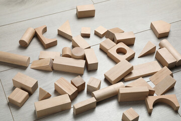 Wooden building blocks set on floor. Child's toy