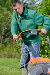 close up of mower cutting the grass