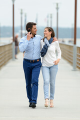 a happy couple walking outdoors