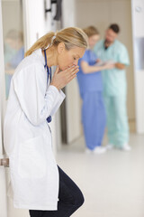 stressed medical doctor woman on the corridor