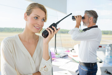 attractive people at work in aviation control tower