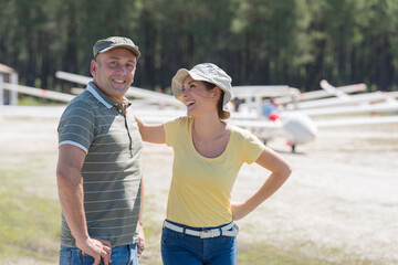 middle aged couple at an airfield