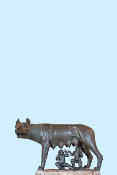 Cover page with a monument of a mother wolf feeding enfants, Romulus and Remus at Rome, Italy, with copy space and blue sky solid background.