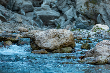 rocks in a mountain stream at the bottom of the canyon close-up