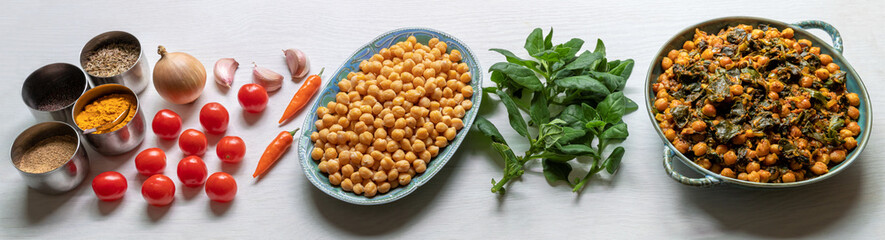 Ready chickpea dish with ingredients and spices banner. Vegan cuisine.