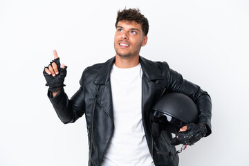 Young caucasian man with a motorcycle helmet isolated on white background pointing up a great idea