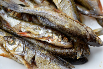 Delicious fried river fish on a plate