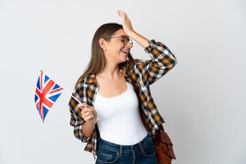 Young Lithuanian woman holding an United Kingdom flag isolated on white background has realized something and intending the solution