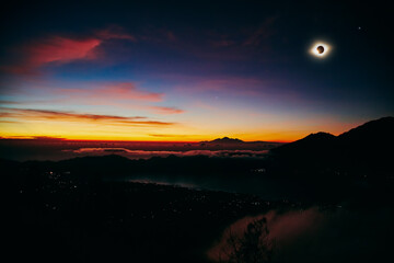 Solar eclipse on a colorful sky.