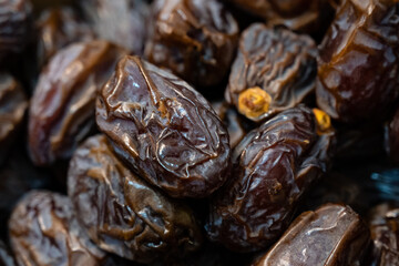 Dried date fruits lie in an open box