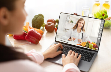 Lady having video call with dietitian, using laptop