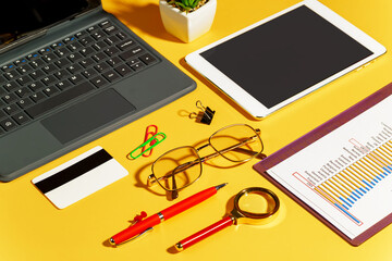 Items for business on bright colors in the office on the table 