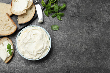 Tasty cream cheese, fresh bread and basil on grey table, flat lay. Space for text