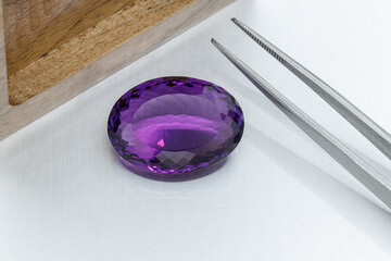 macro mineral faceted stone cut Amethysts on a gray background