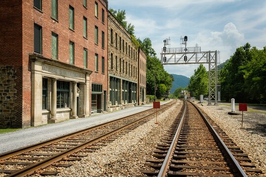 Railroad tracks and historic buildings in Thurmond, a ghost town in the New River Gorge of West Virginia