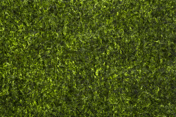 Nori leaf texture. Close-up of nori leaf as background, top view. Appetizer made from kelp. - obrazy, fototapety, plakaty