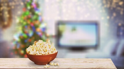 Christmas eve. watching tv and eating popcorn. Home cinema.