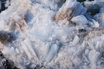 Fragments of river ice during ice drift. Ice texture on a spring day under the sun. Amur river. © Алексей Игнатов