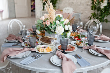 Served table next to the decor. Wedding decoration. Close-up.