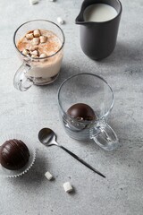 Hot cocoa chocolate ball bomb with marshmallow. Holiday winter drink. Handmade Christmas present. Selective focus.