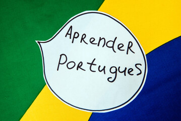 brazilian national flag. inscription learn portugues. foreign language learning concept