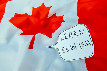 canada national flag. inscription learn english. foreign language learning concept