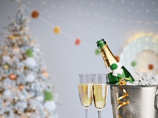 A bottle of champagne on a background decorated for New Years celebration