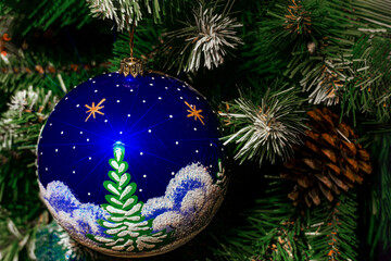 Large blue ball on a Christmas tree.