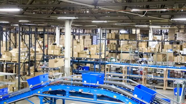 Shot of Bins Moving Along a Conveyor Belt in a Warehouse Distribution Center