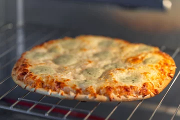 Foto op Plexiglas Homemade four cheese pizza in the oven © Freelancer