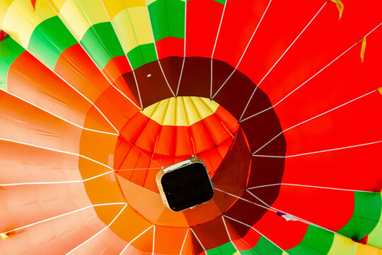A balloon in the air as seen from below. bright, saturated colors