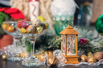 Fototapeta na wymiar Holiday Christmas decoration still life with colorful walnuts, selective focus