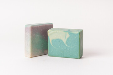 Two pieces of natural handmade soap. Green organic soap with the smell of pine needles