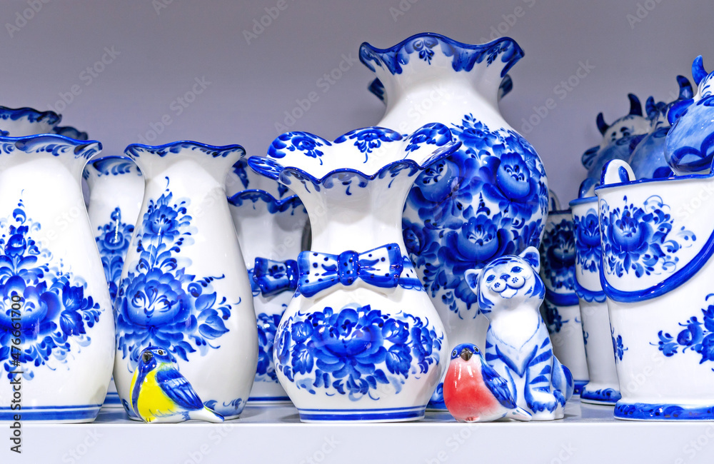 Wall mural Porcelain utensil with blue floral patterns in the Russian style - gzhel. Traditional russian souvenir.